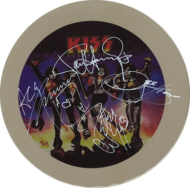 Kiss Autographed / Signed 10" Drumhead Replica with black metal display stand.