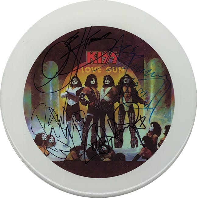 Kiss Autographed / Signed 10" Drumhead Replica with black metal display stand.